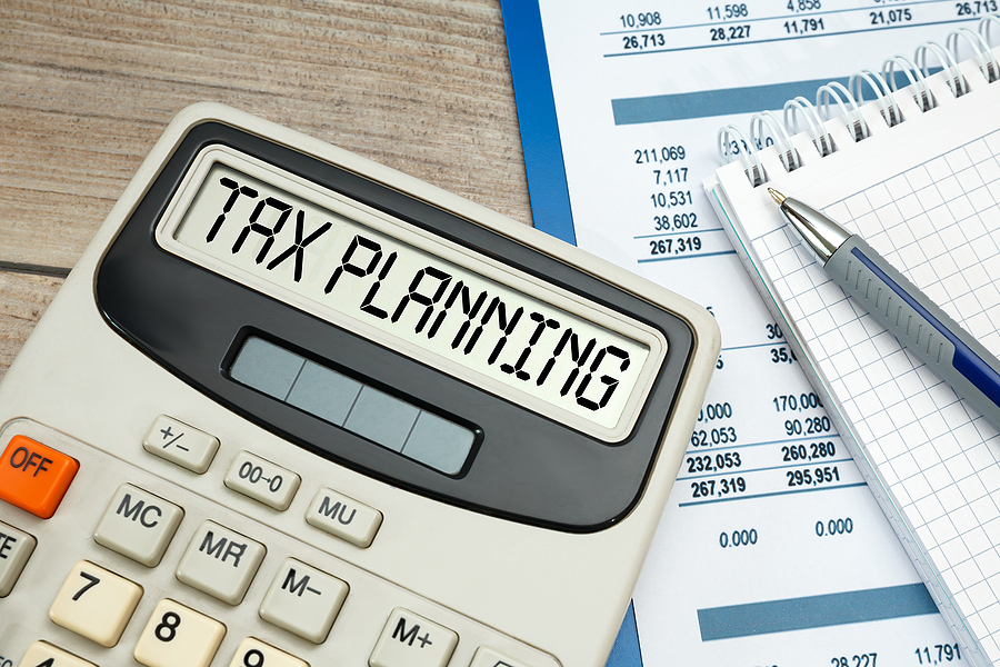 A calculator and other sheets needed for tax planning