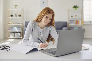 Woman finishing taxes feeling content