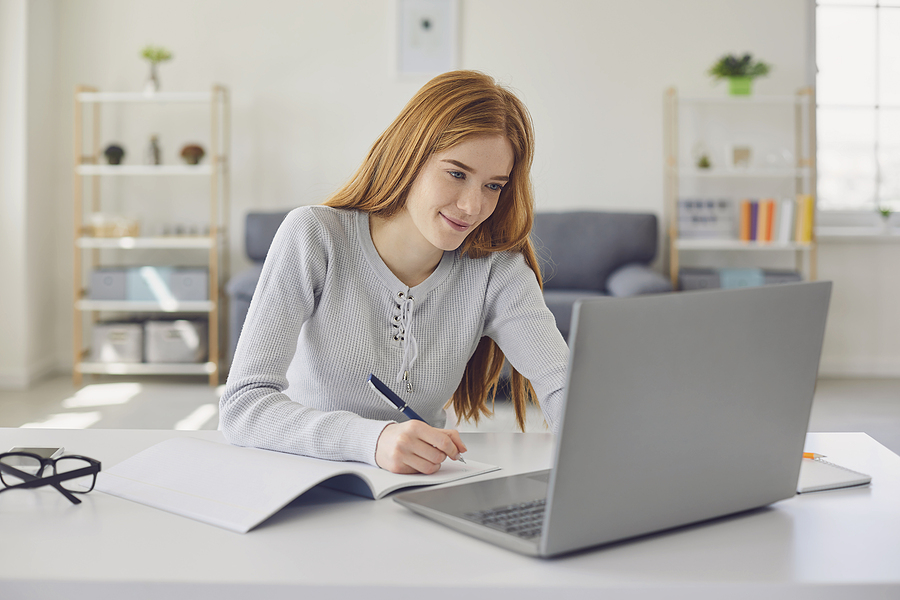 Woman finishing taxes looking content