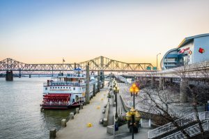 louisville riverfront, walkway, and paddle boat near bridge